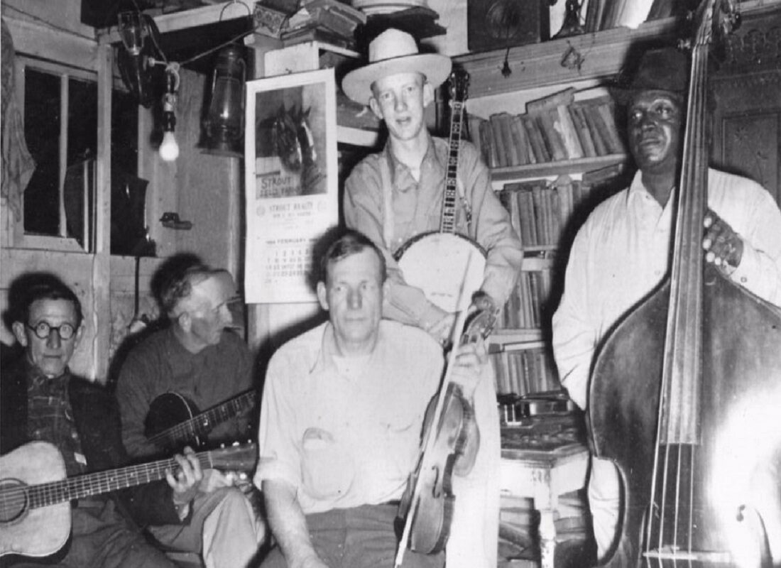 A group of people sitting around in a room.