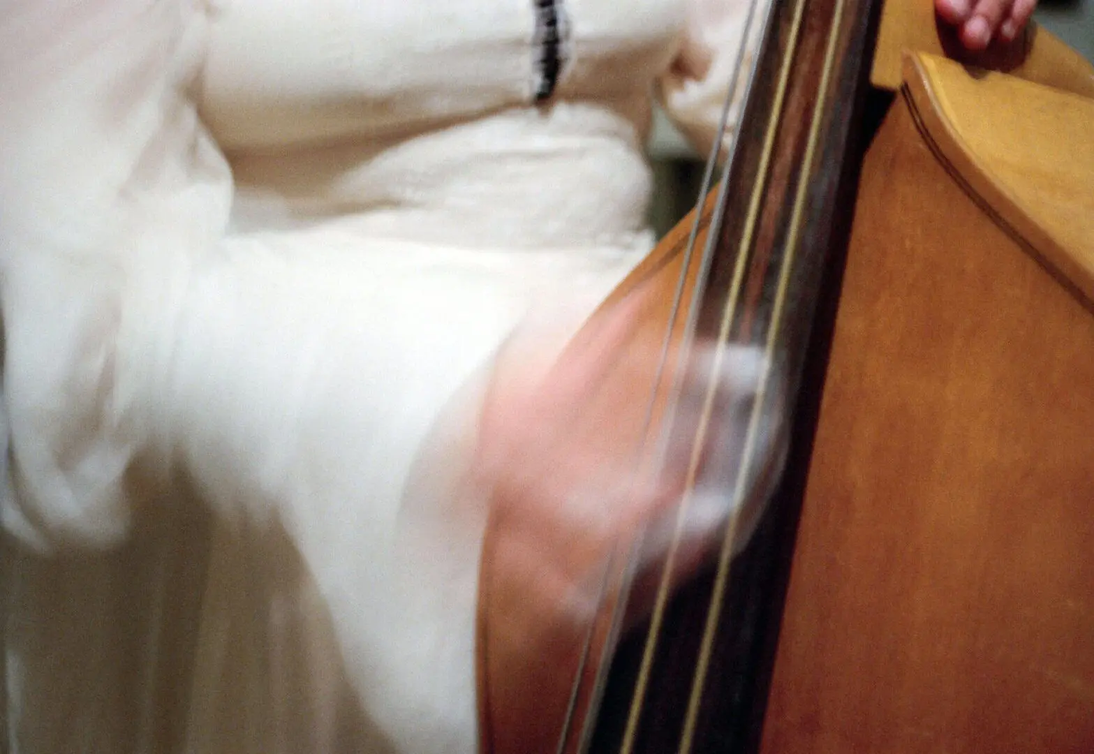 Person playing a double bass instrument.